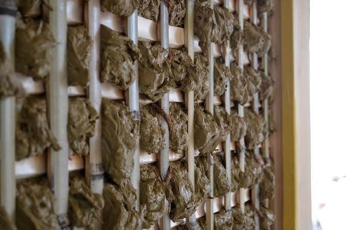 Traditional Japanese earthen wall of clay woven over a bamboo lattice